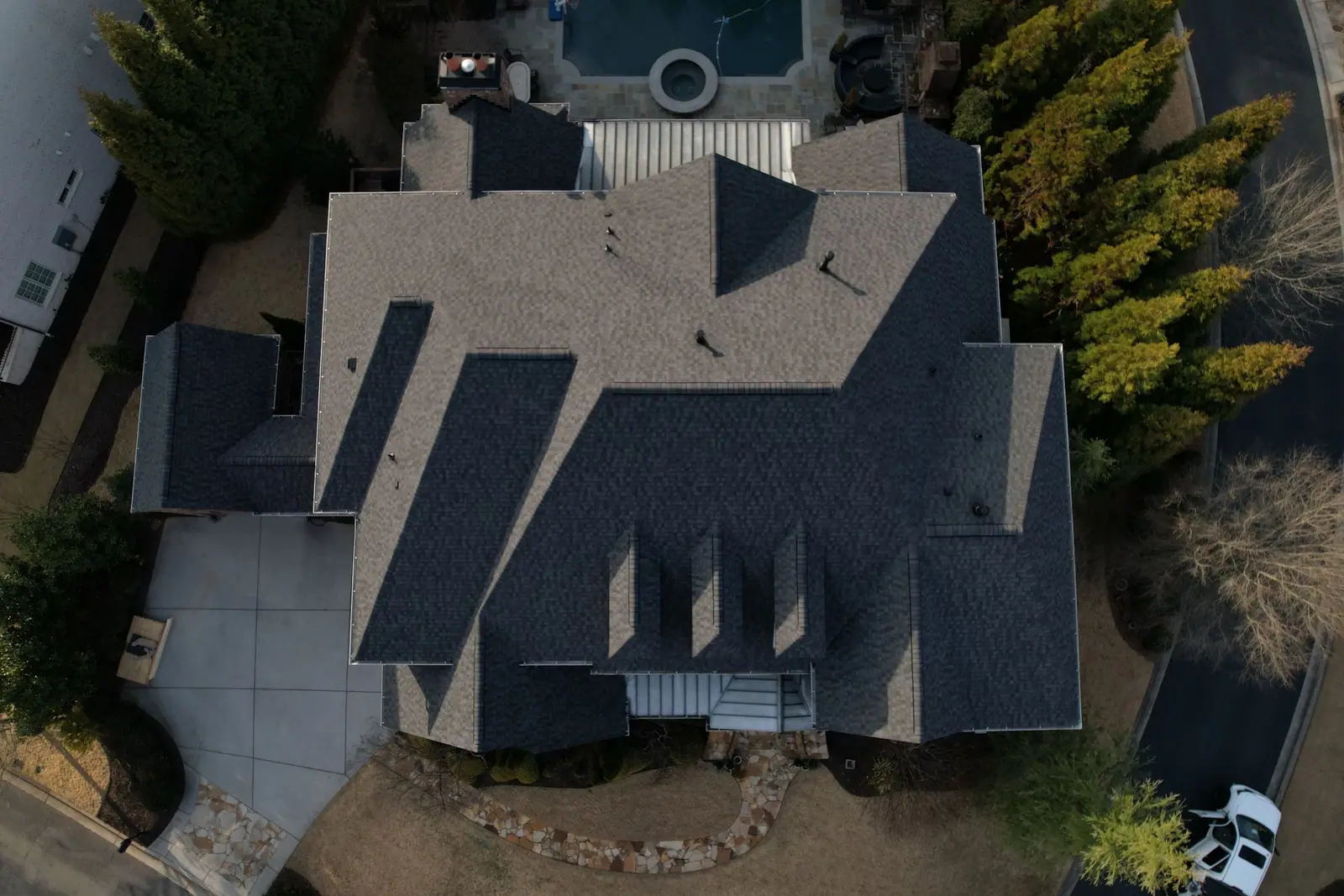 Overhead view of a large multi-gable shingle roof completed by Dryco Roofing