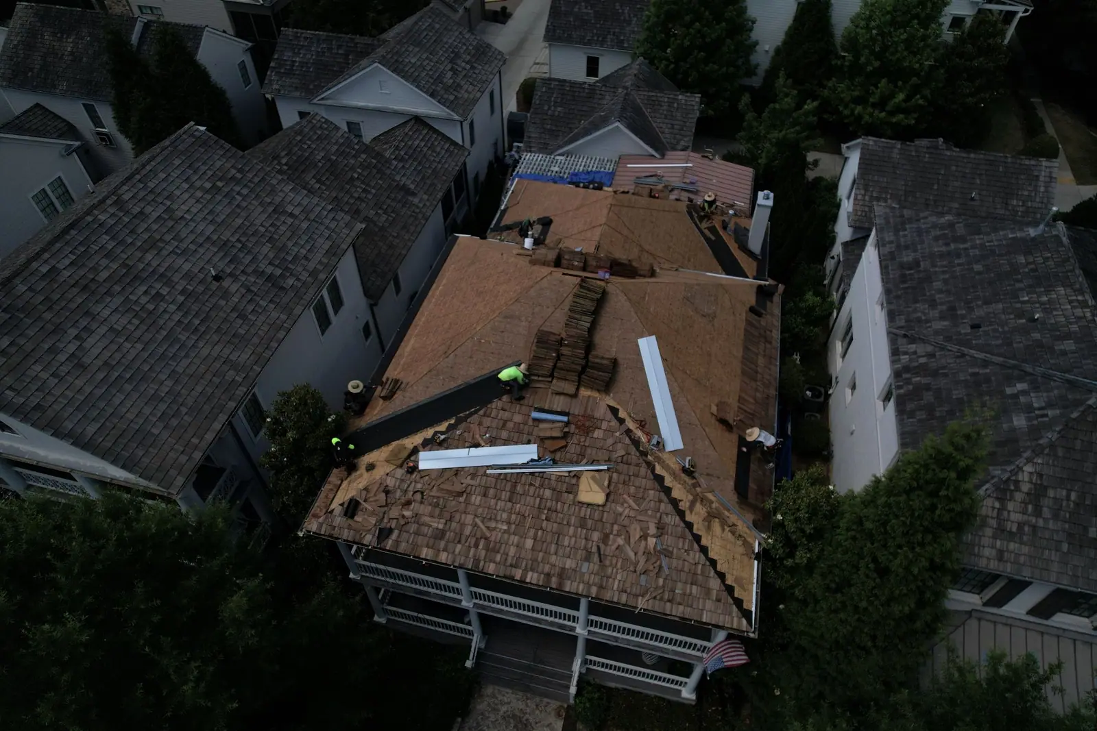 Dryco Roofing crew tearing off an old cedar shake roof