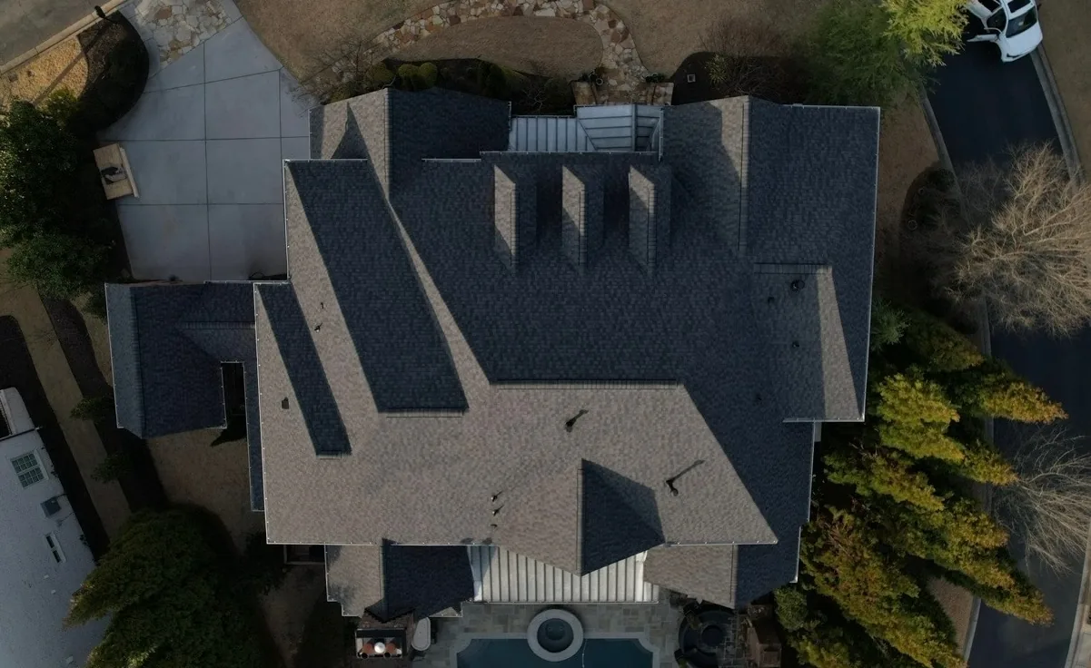 The same home from above with a new charcoal architectural shingle roof by Dryco Roofing
