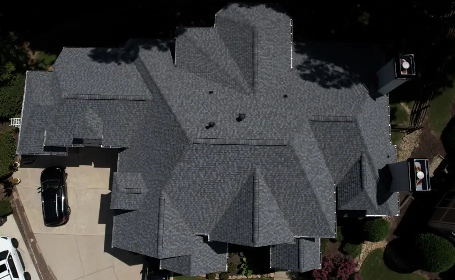 Straight-down view of a complex grey shingle roof used for a roof inspection